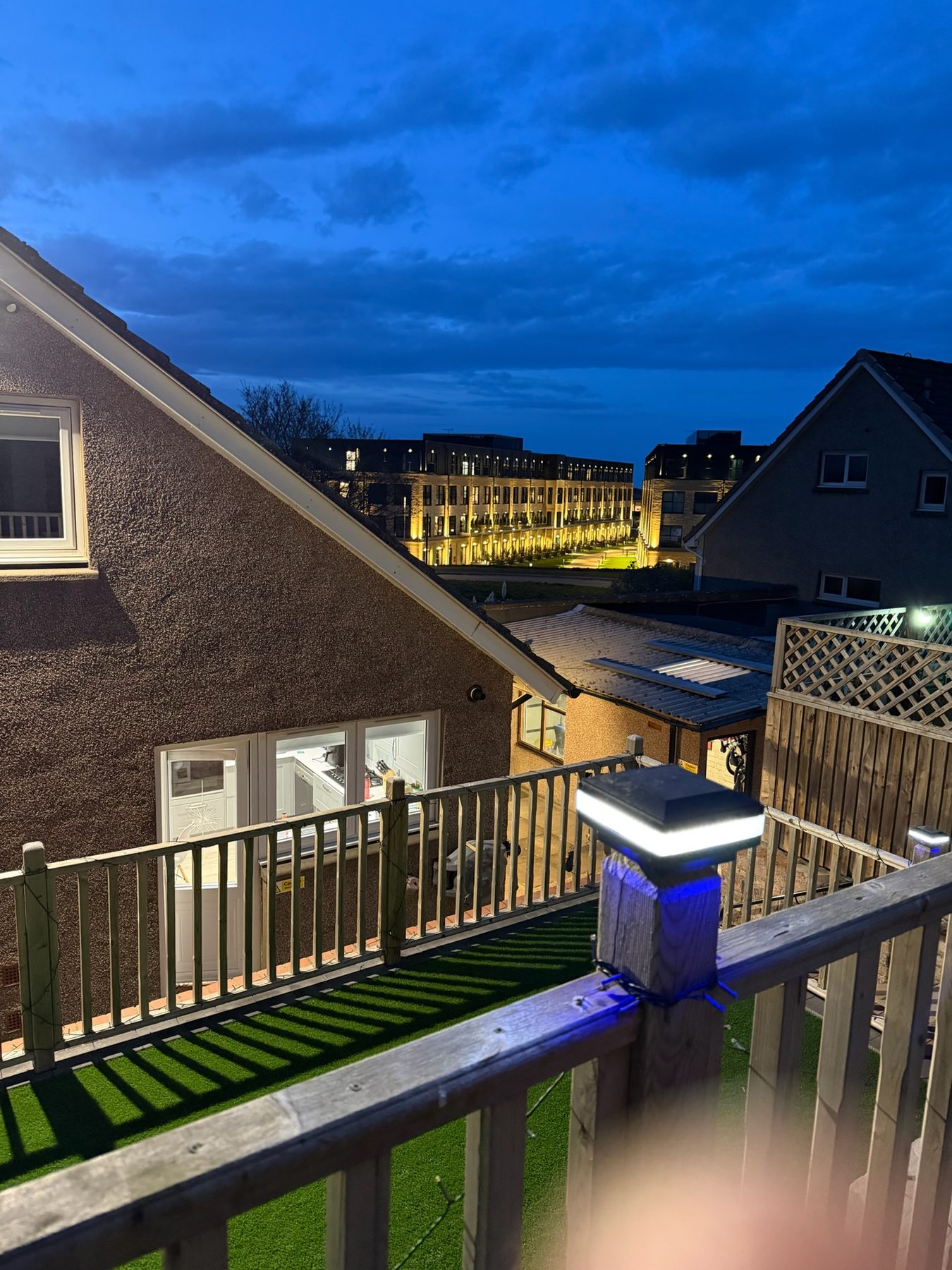 View from Butterfly House at dusk, with the lights of St Andrews in the distance.